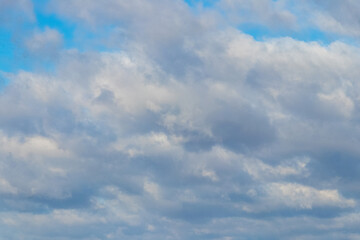 Fototapeta premium The blue sky is covered with dense white clouds