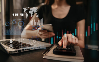 Investors are calculating on calculator investment costs and holding smartphone in hand.