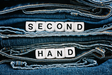 Second hand, Vintage Shopping, slow fashion, Sustainable fashion concept. Stack of blue old denim...