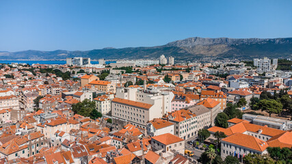 Fototapeta na wymiar Drone shot Croatian city of Split in the resort region of Dalmatia. Hill with paths and city views Main attraction. Split city on the background of the mountains of Croatia.