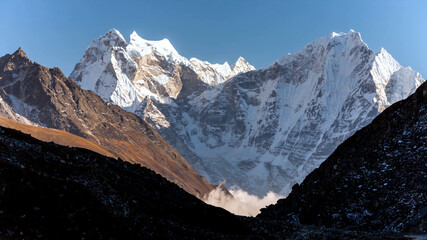 Mountain everest snow white cold freeze top of the world blue skies cloud shadow beautiful amazing view brown rock drone aerial chomolungma nepal tibet 