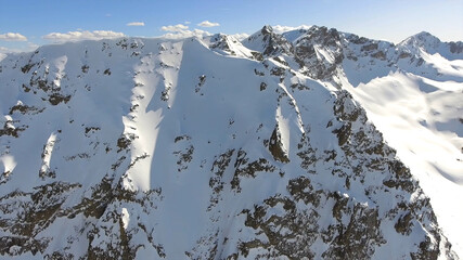 Mountain everest snow white cold freeze top of the world blue skies cloud shadow beautiful amazing view brown rock drone aerial chomolungma nepal tibet 