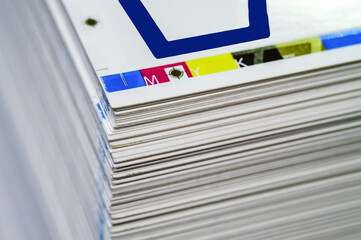 Sheets of printed products. Offset printing. CMYK press. Paper at the printing house.