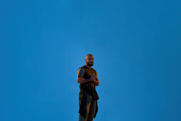 Fototapeta premium Young cool caucasian hip hop dancer look at camera