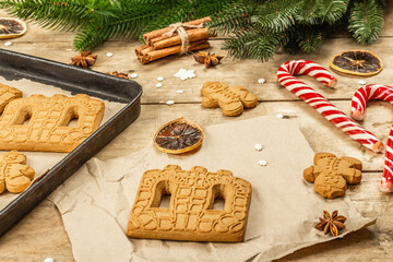Christmas Gingerbread House and Gingerbread Men. Traditional New Year design, cooking process