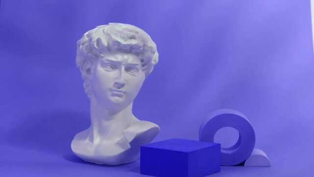 bust of a statue of david and a scene for your product on a very peri color background, mock up stands for rendering tren of the year 2022