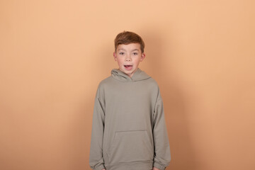 Teen boy portrait teenager isolated on brown background. emotions on face. feelings and facial expression concept. advertisement. copy free space for text.