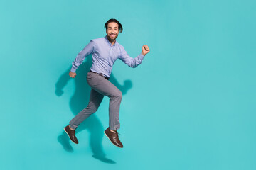 Photo of sportive hurry sales agent jump run wear purple shirt trousers shoes isolated turquoise color background