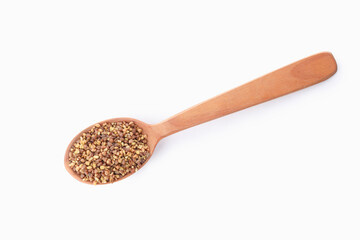 Spoon of buckwheat tea isolated on white background