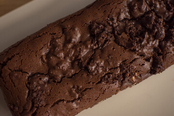 brownie cake with chocolate and pecan chunks viewed diagonally from above