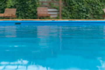 Fototapeta na wymiar Patio and blue water pool.