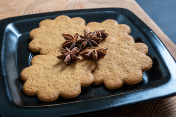 A pile of homebaked gingerbread cookies on a plate