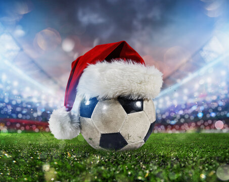 Soccer ball in a stadium with the Christmas hat