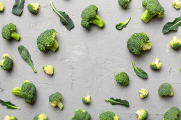 Flat lay composition with fresh green broccoli frame eith copy space on light background