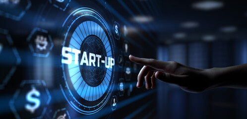 Startup new business development concept. Hand pressing button on screen.