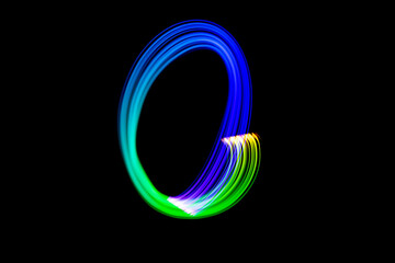 Freezelight photography. Isolated figure on a black background. Number zero.