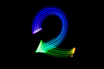 Freezelight photography. Isolated figure on a black background. Number two.