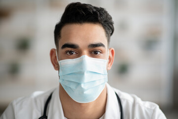 Closeup portrait of arab guy doctor in face mask
