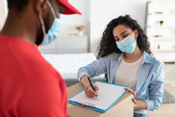 Customer In Face Mask Receiving Order Signing Paper Form