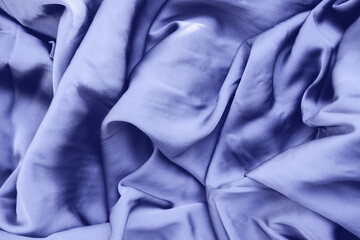 Top view silk fabric texture. Very purple trend color 2022 fabric background. top view.