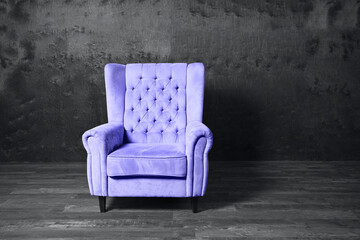 Violet very peri color 2022  armchair over grey background. Trendy color 2021 year. Copy space. 