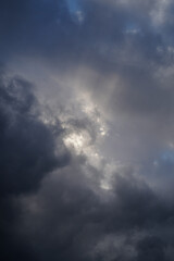 Sun rays in moody clouds