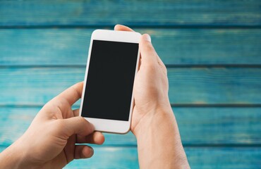 Mobile phone or cell phone being held showing the blank screen