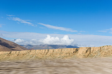 plateau wilderness with dirt road motion blur