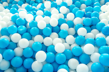 Lots of blue and white plastic balls