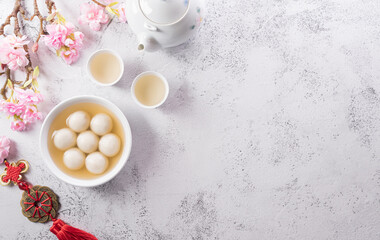 Fototapeta na wymiar Tang Yuan(sweet dumplings balls), a traditional cuisine for Mid-autumn, Dongzhi (winter solstice ) and Chinese new year. Chinese characters FU in the article refer to fortune, wealth, money flow.