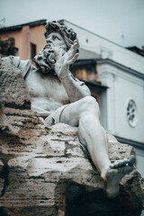 Marble sculpture representing the Danube, one of the four main sculptures in the Fontana dei Fiumi, located in Piazza Navona 