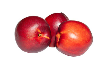 Three fresh peaches isolated on teh white background