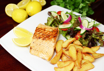Fish salmon and chips with salad
