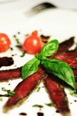 Comber, loin with basil and tomatoes