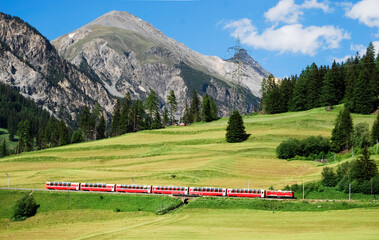The Bernina Express, part of the Rhätische Bahn, near Bergün en route from St. Moritz to Chur in...