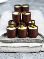 close-up of chocolate candies on minimalistic gray background
