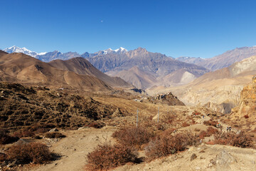 View of the village of Jharkot. Mustang District, Nepal. Dhaulagiri and Tukuche Peak in the...