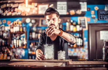 Bartender makes a cocktail in the beerhall