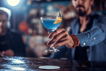 Bartender mixes a cocktail at the public house