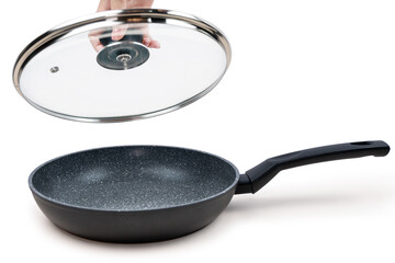 Black non-stick frying pan with open glass lid in hand isolated on white background