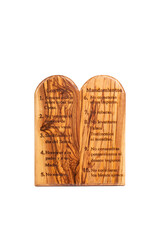 Two wooden tablets engraved with the Ten Commandments in Spanish isolated on white background.