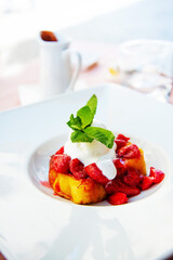 French toast grilled  strawberries and ice cream on top