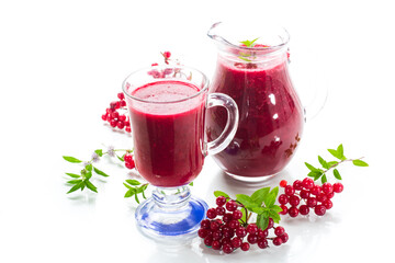 freshly squeezed thick natural juice with pulp from ripe red viburnum in a decanter