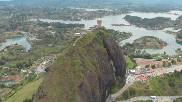 Aerial View Of Piedra del Penol, Guatape Colombia On A Misty Day - drone shot