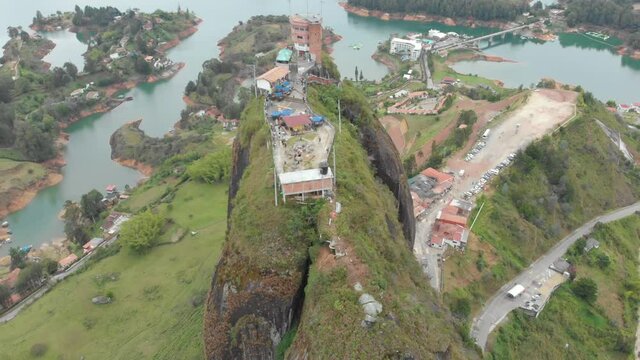 Aerial View Over Piedra Del Penol Rock In Guatape Medellin Colombia - drone shot