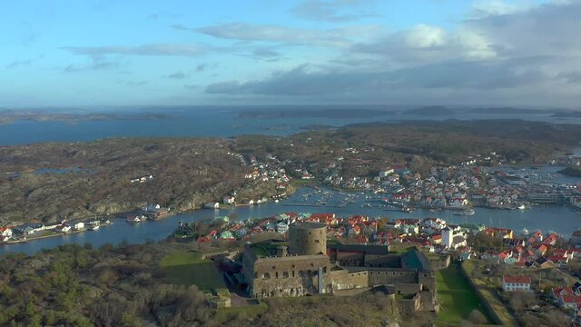 Carlsten stone fortress at Marstrand coast of Sweden, aerial establishing shot, panoramic touristic landmark landscape