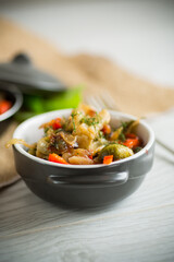 fried brussels sprouts with cauliflower and other vegetables in a bowl