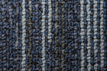 Fototapeta premium Seamless close up of monochrome grey carpet texture background from above.