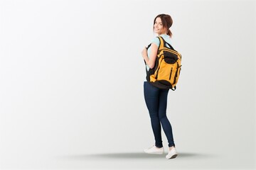 Happy young student posing with a backpack