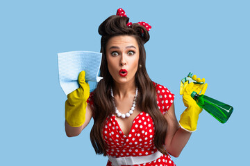 Surprised pinup lady in retro clothes cleaning screen with rag, using spray detergent on blue...